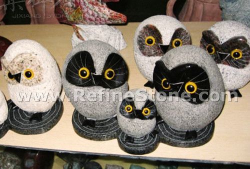 Grey and black owl granite carving