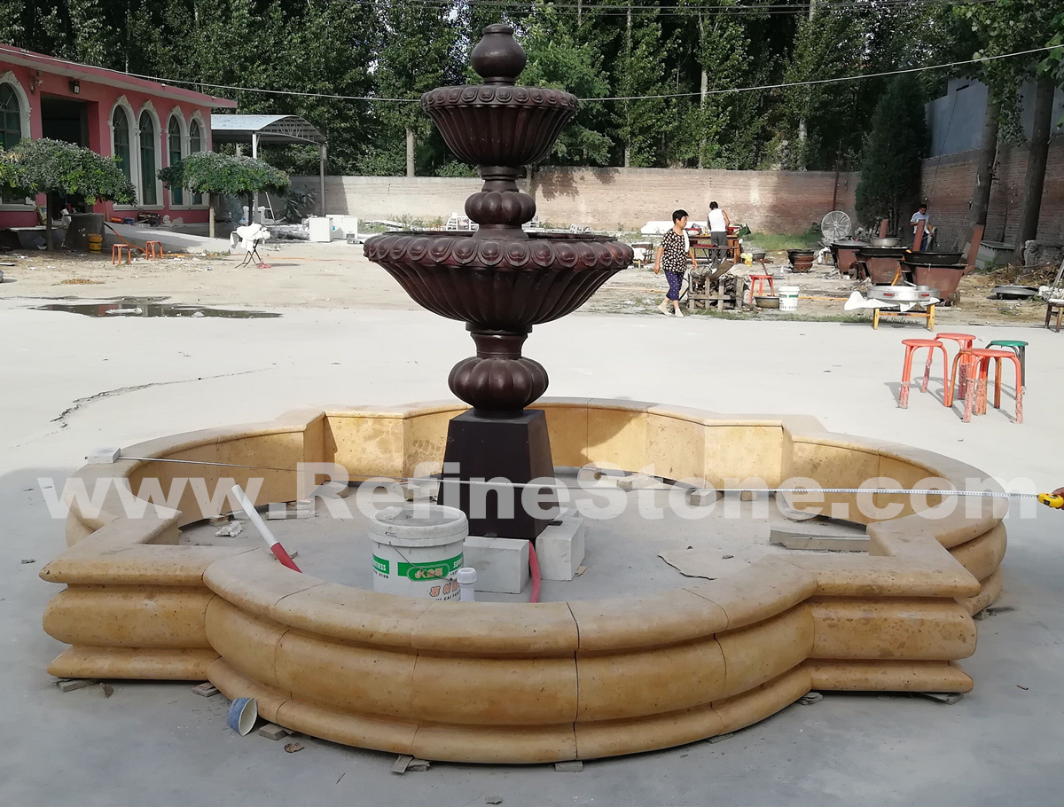 yellow limestone with bronze fountain