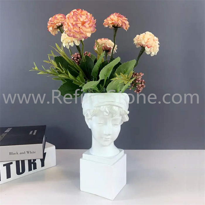White marble human bust vase